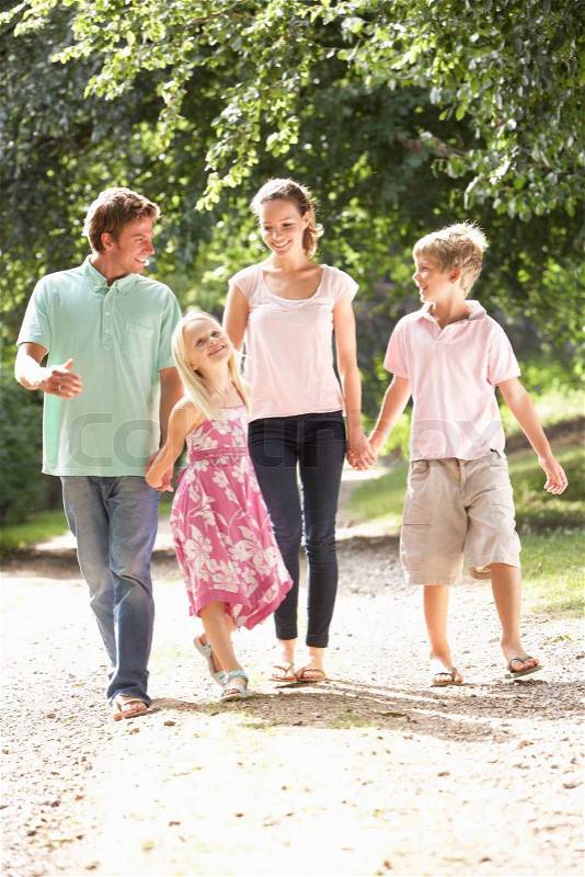 Family Walking In Countryside Together, stock photo