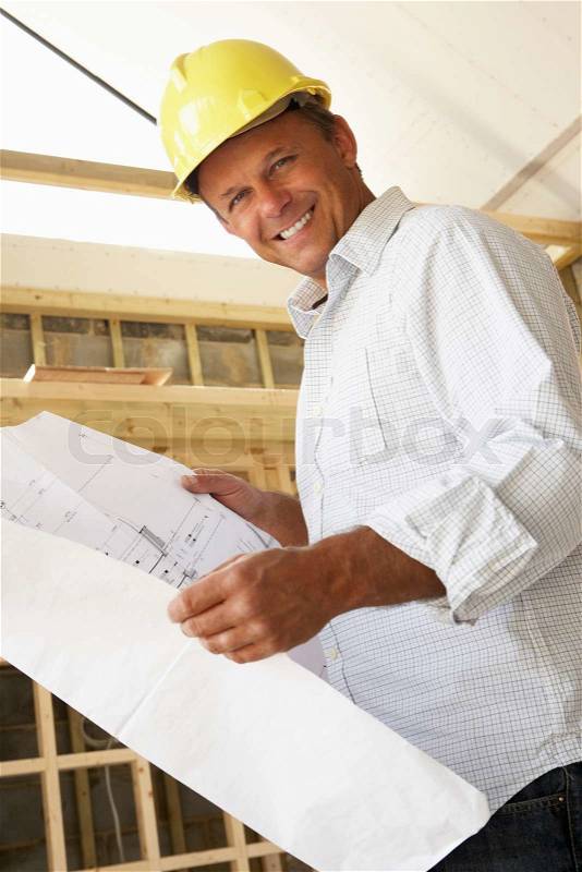 Architect With Plans In New Home, stock photo