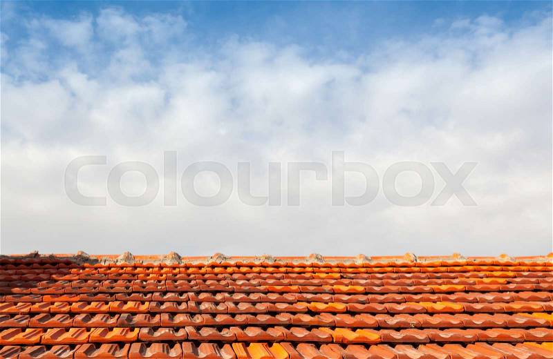 Empty photo background with red tile roof and cloudy sky, stock photo