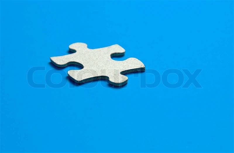 Missing puzzle piece the key to success, stock photo