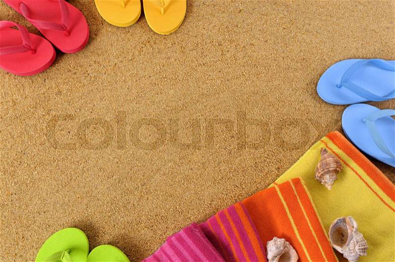 Beach background with towel and flip flops. Space for copy, stock photo