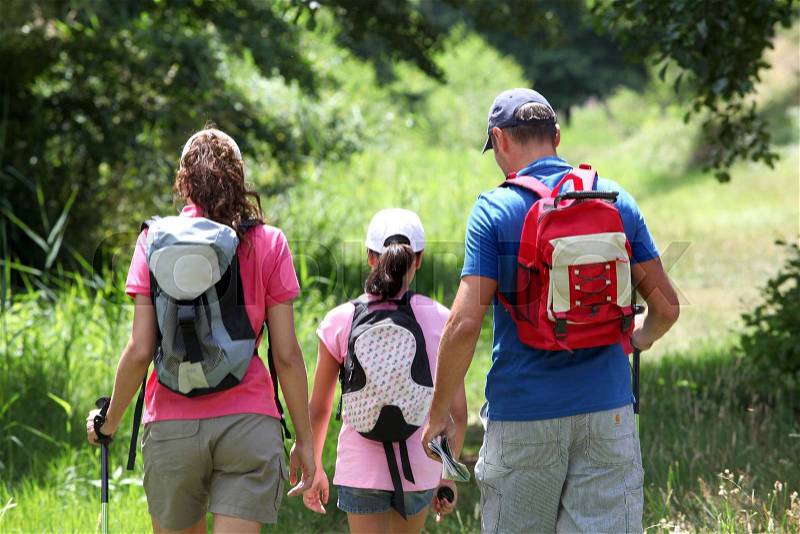 Family hiking in the countryside, stock photo