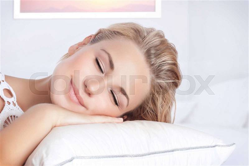 Closeup portrait of nice female sleeping in bedroom at home, calm peaceful bed time, healthy lifestyle, conception of relaxation, stock photo