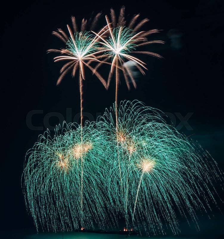 Beautiful colorful holiday fireworks on the black sky background, stock photo
