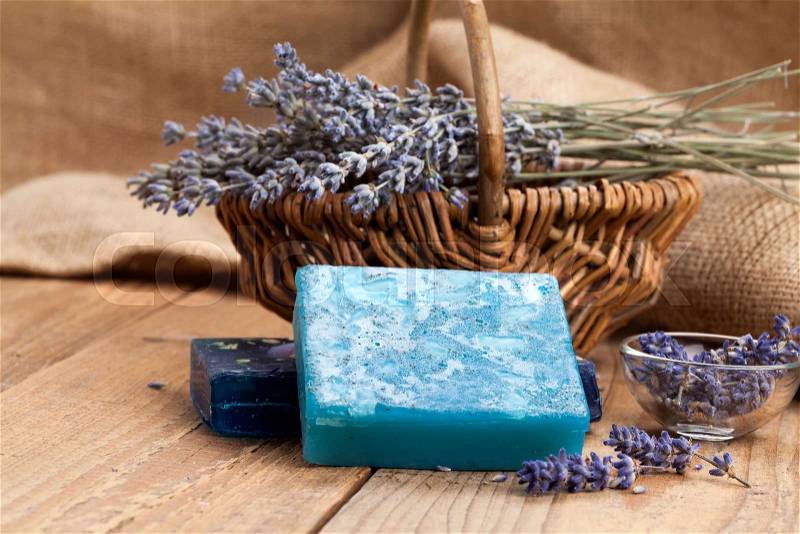 Lavender handmade soap bars, on wooden background, stock photo