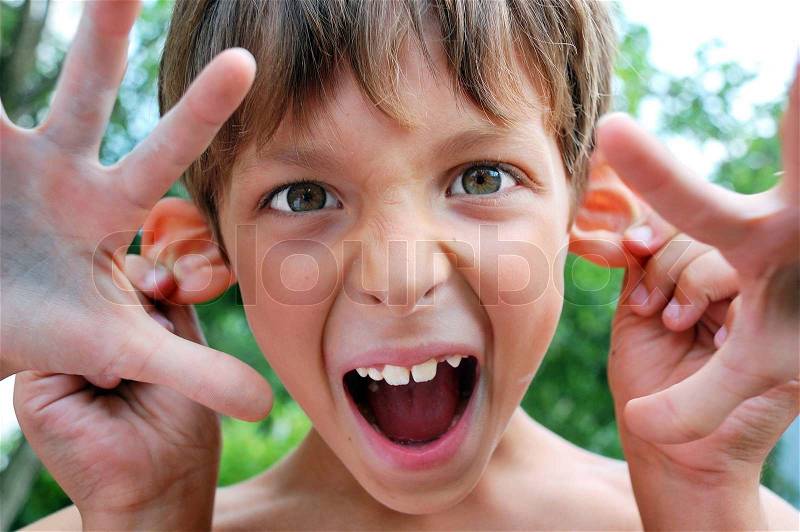 Child making faces, stock photo
