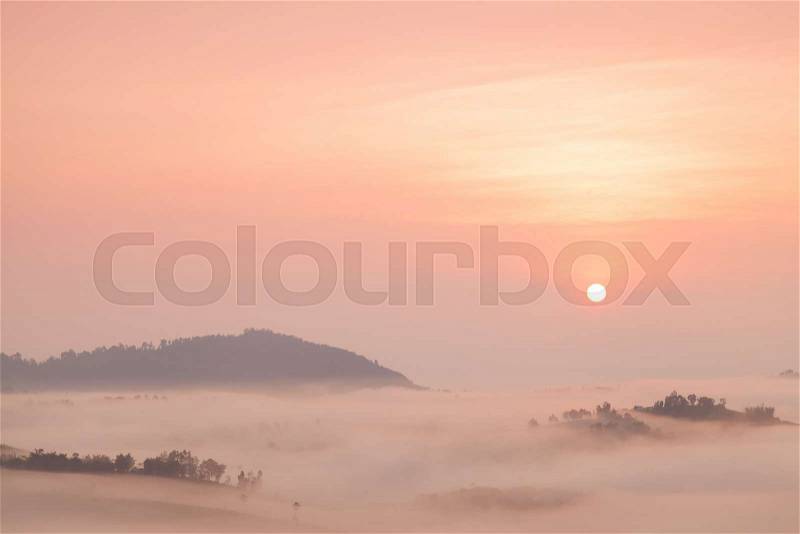 Fog covered mountains And the rising sun. Fog that covered the mountains and forests in the morning, stock photo