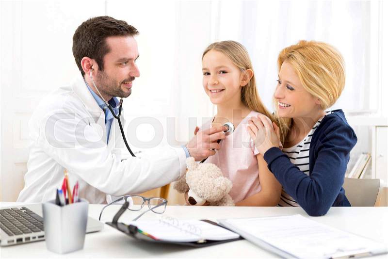 View of a Doctor listening heart beatment of little girl , stock photo