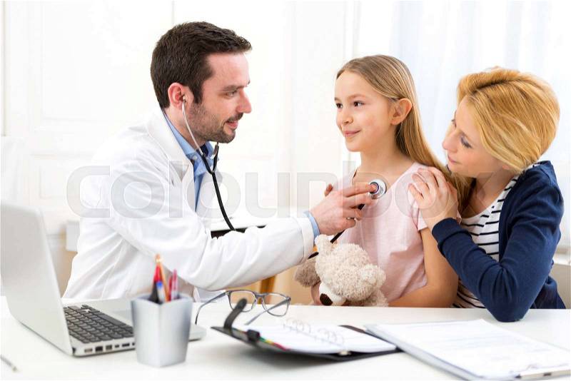 View of a Doctor listening heart beatment of little girl , stock photo