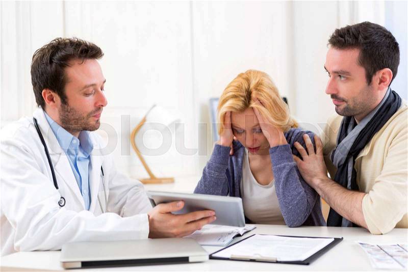 View of a Man goes with his girlfriend on her visits to the doctor, stock photo