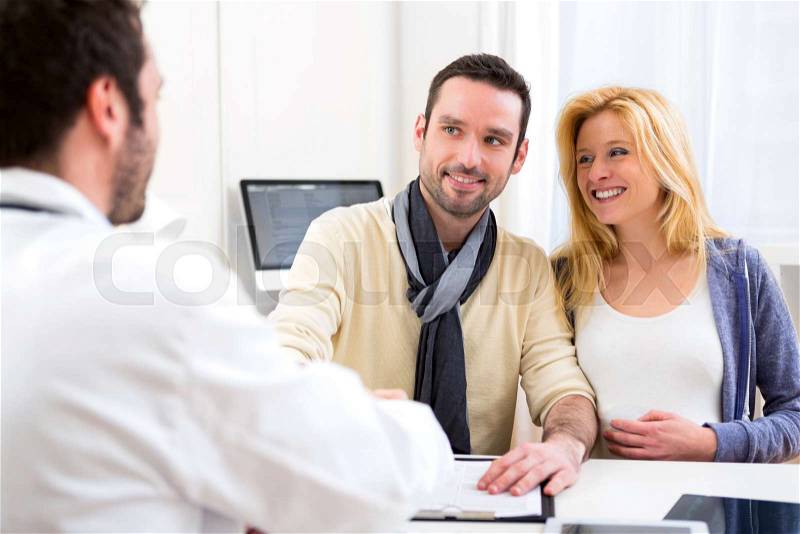 View of a young attractive futur dad hand shaking with the doctor, stock photo