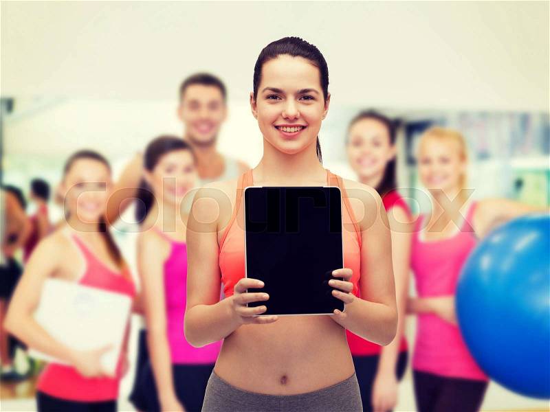 Sport, exercise, technology, internet and healthcare - sporty woman with tablet pc blank screen, stock photo