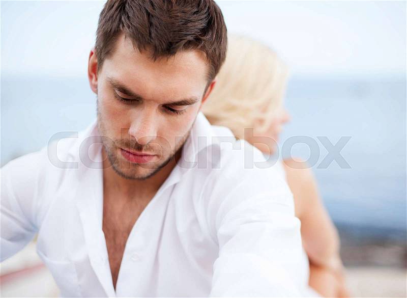 Dating and relationships concept - stressed man with man outside, stock photo