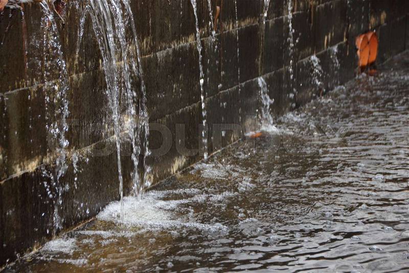 Embankment under Water Pressure with Water Spraying and creating small waterfall, stock photo
