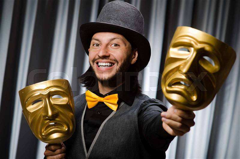 Funny concept with theatrical mask, stock photo