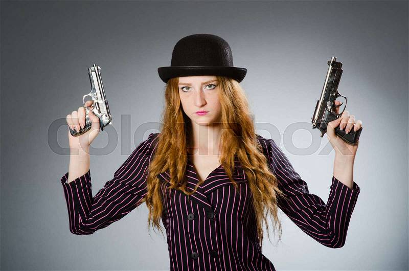 Woman gangster with gun in vintage concept, stock photo