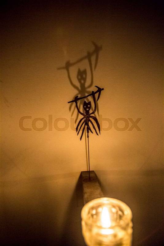 Closeup photo of scary shadow of demon on wall, stock photo