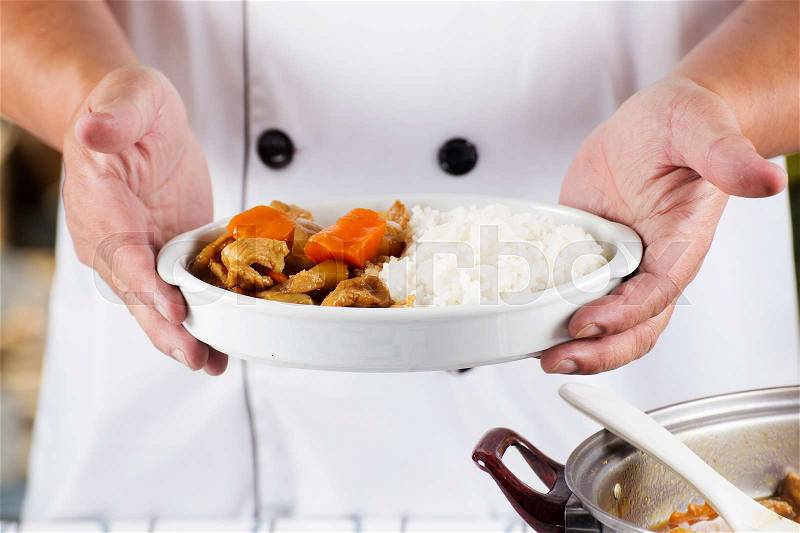 Chef presented Japanese pork curry with steam rice / cooking Japanese pork curry paste concept , stock photo