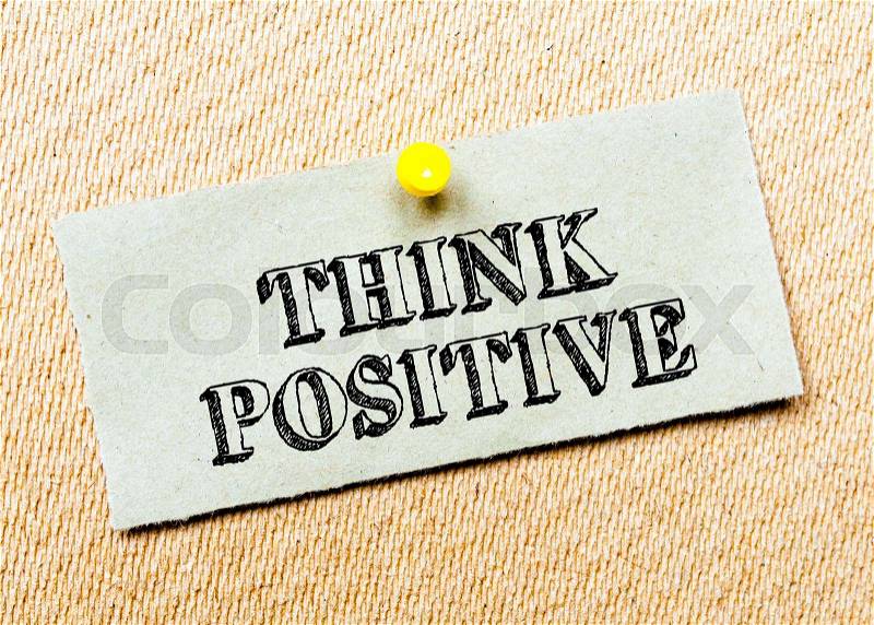 Recycled paper note pinned on cork board.Think positive Message. Concept Image, stock photo