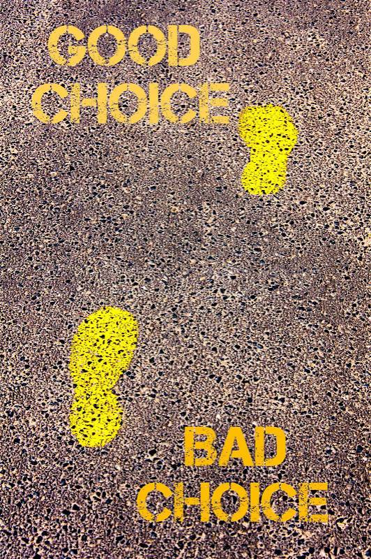 Yellow footsteps on sidewalk from Bad Choice to Good Choice message. Conceptual image, stock photo