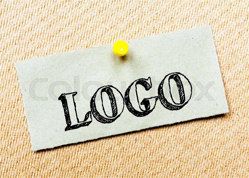 Recycled paper note pinned on cork board. Logo Message. Concept Image, stock photo