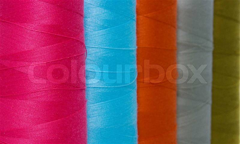 Different colors of cotton for textile industry, stock photo