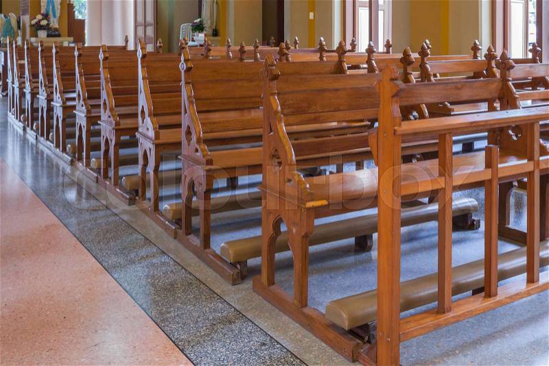 Walkway and Wood Bench of Catholic church, people can pray for god jesus, stock photo