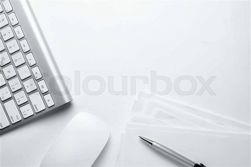 Conceptual White Office Stuffs on Top of White Table with Copy Space for Texts On Upper Right Side, stock photo