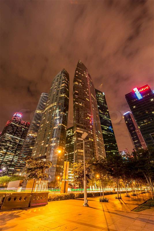 Skysrapers in Singapore during night hours, stock photo