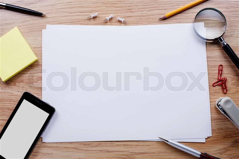 Office stationery and mobile phone on the table with copy space for texts, stock photo