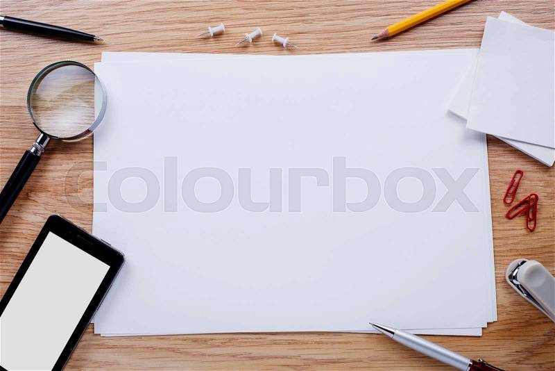 Office stationery and mobile phone on the table with copy space for texts, stock photo