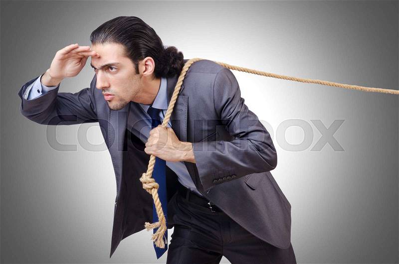 Businessman pulling rope on white, stock photo