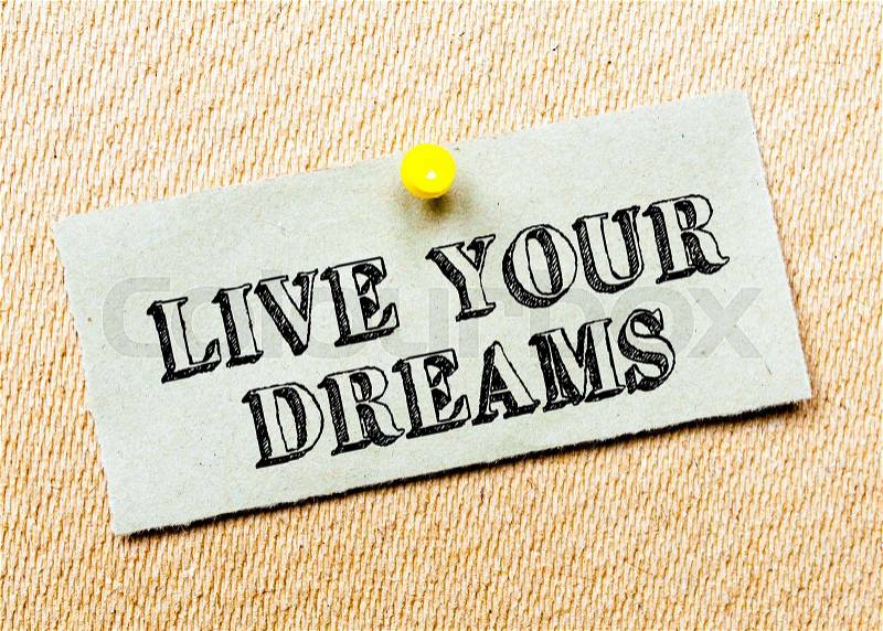 Recycled paper note pinned on cork board. Live Your Dreams Message. Concept Image, stock photo