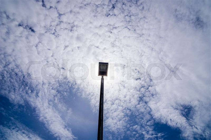 Black Light pole in the blue sky, stock photo