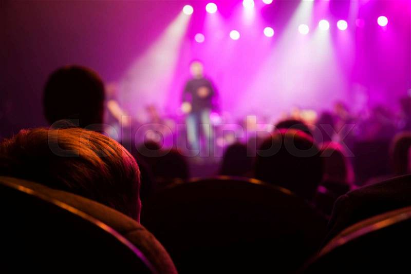 The audience at a concert on the background of the scene, stock photo