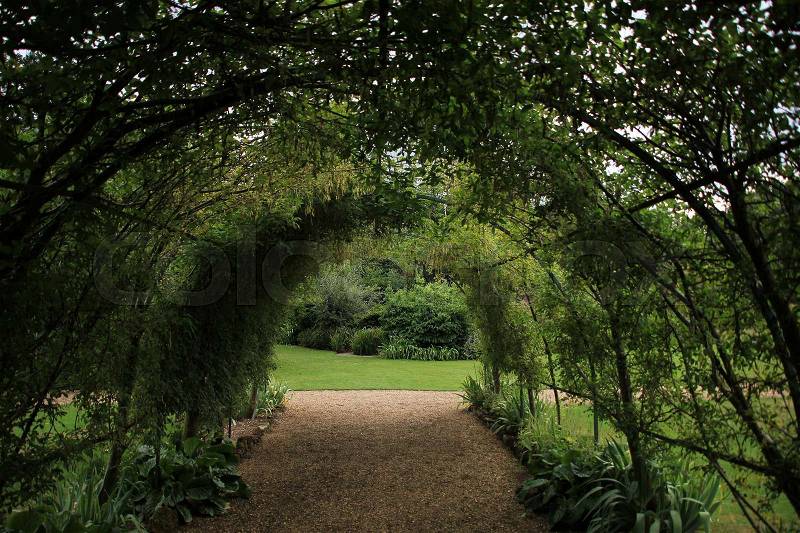 Wonderful bow with vegetation in the garden in the park of Osborne House in England in the summer, stock photo