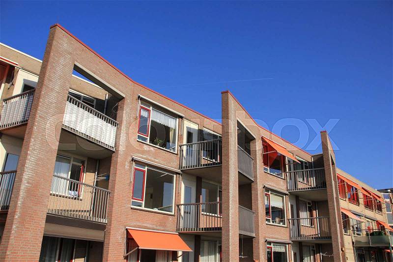 Blue sky and a building with apartments for old aged people in the summer in Holland, stock photo