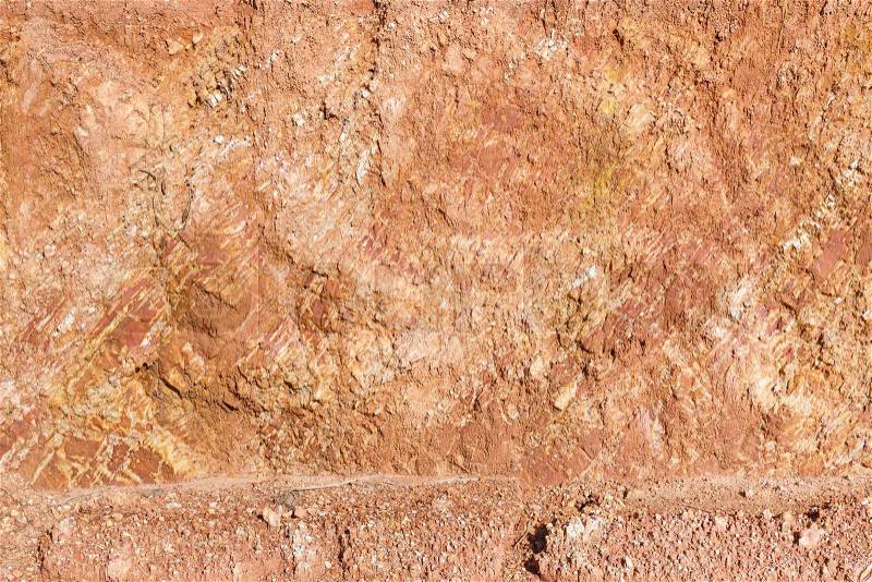 Close up red color lateritic soil cross section, stock photo
