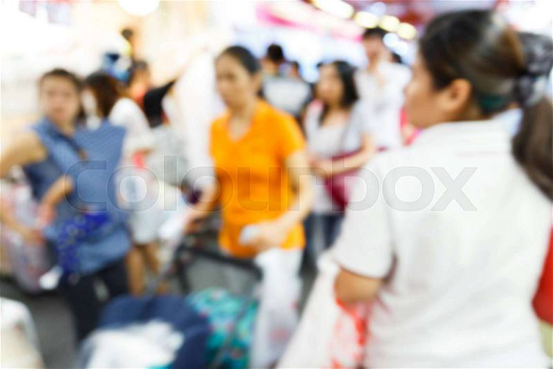Abstract Blurry soft and out of focus people in shopping center, stock photo
