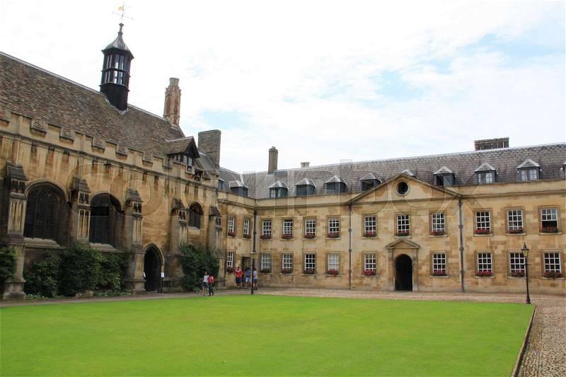 Wonderful courtyard with a lawn of an University in Cambridge in England in the summer, stock photo