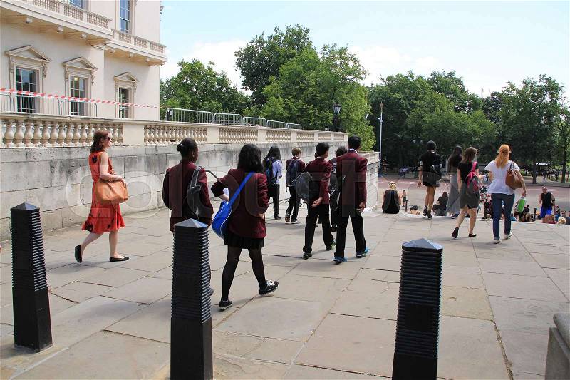 New students walk in the neigbourhood of Hyde Park in London in England in the summer, stock photo