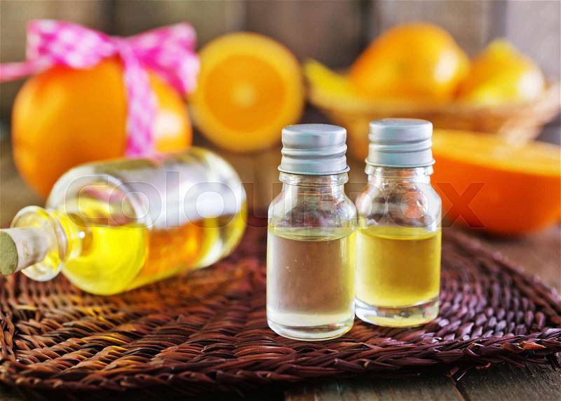 Aroma oil in bottle and on a table, stock photo