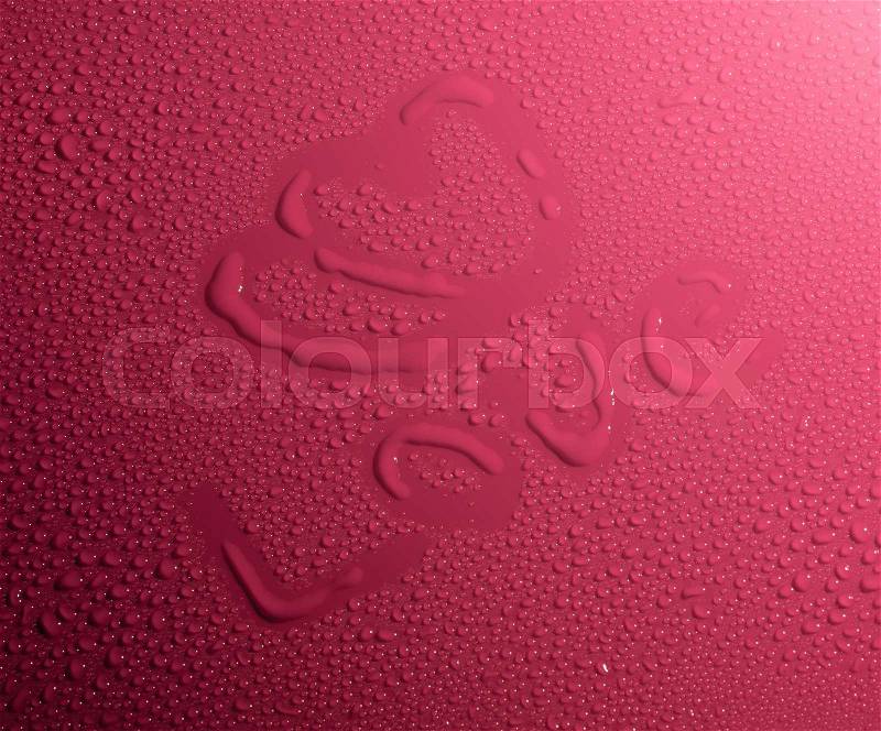 Valentine Day Love heart made by water bubbles on a red background, stock photo