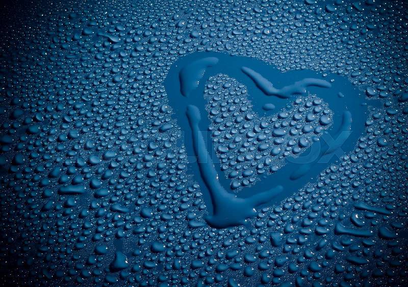 Valentine Day Love heart made by water bubbles on a blue background, stock photo