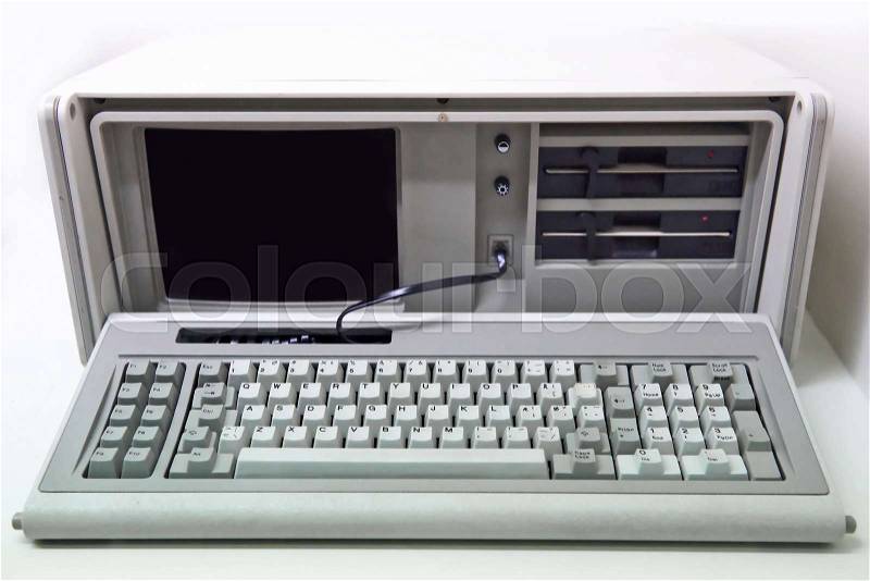 Old white personal computer with floppy disk drives, stock photo