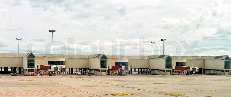Airport terminal docks. View from outdoors, stock photo