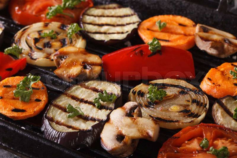 Fresh vegetables cooked in a black skillet grill macro. horizontal , stock photo