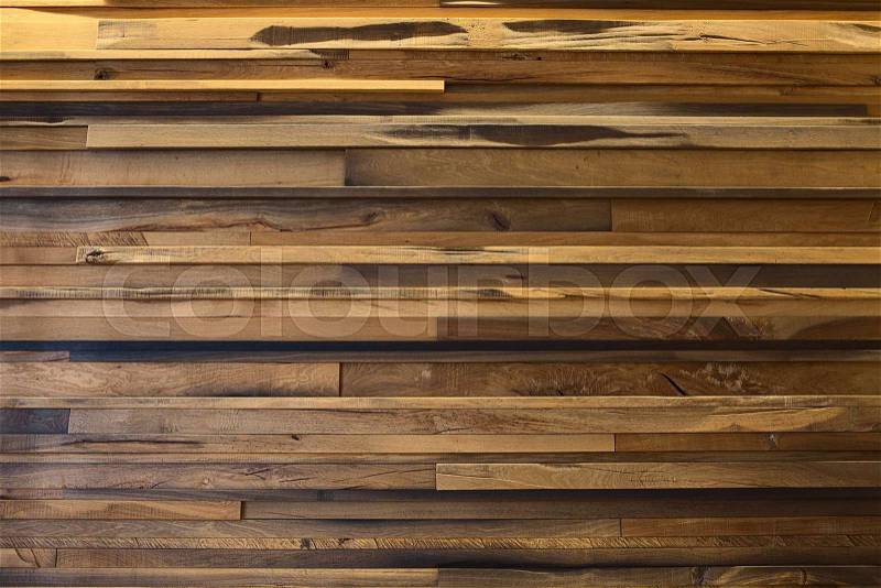 Horizontal rows of wooden yellow oak planks, different sizes. decoration, stock photo