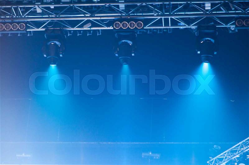 Stage lights on concert. Lighting equipment with multicolored beams, stock photo