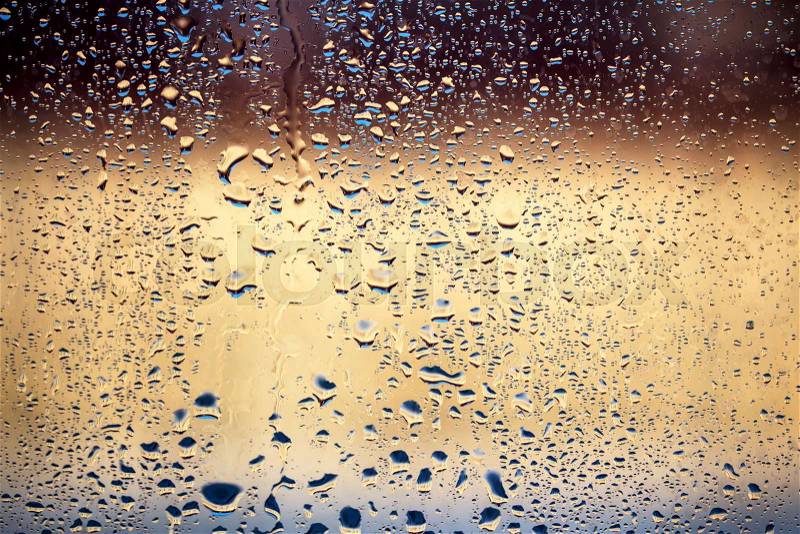 Raindrops on window glass, background, stock photo